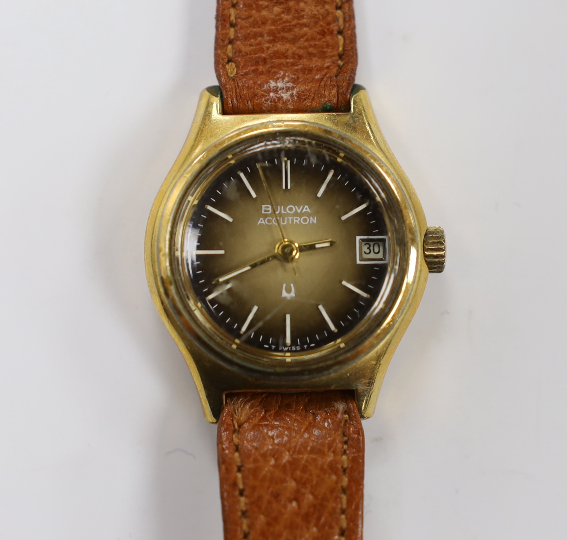 A lady's steel and gold plated Bulova Accutron wrist watch, on a leather strap.